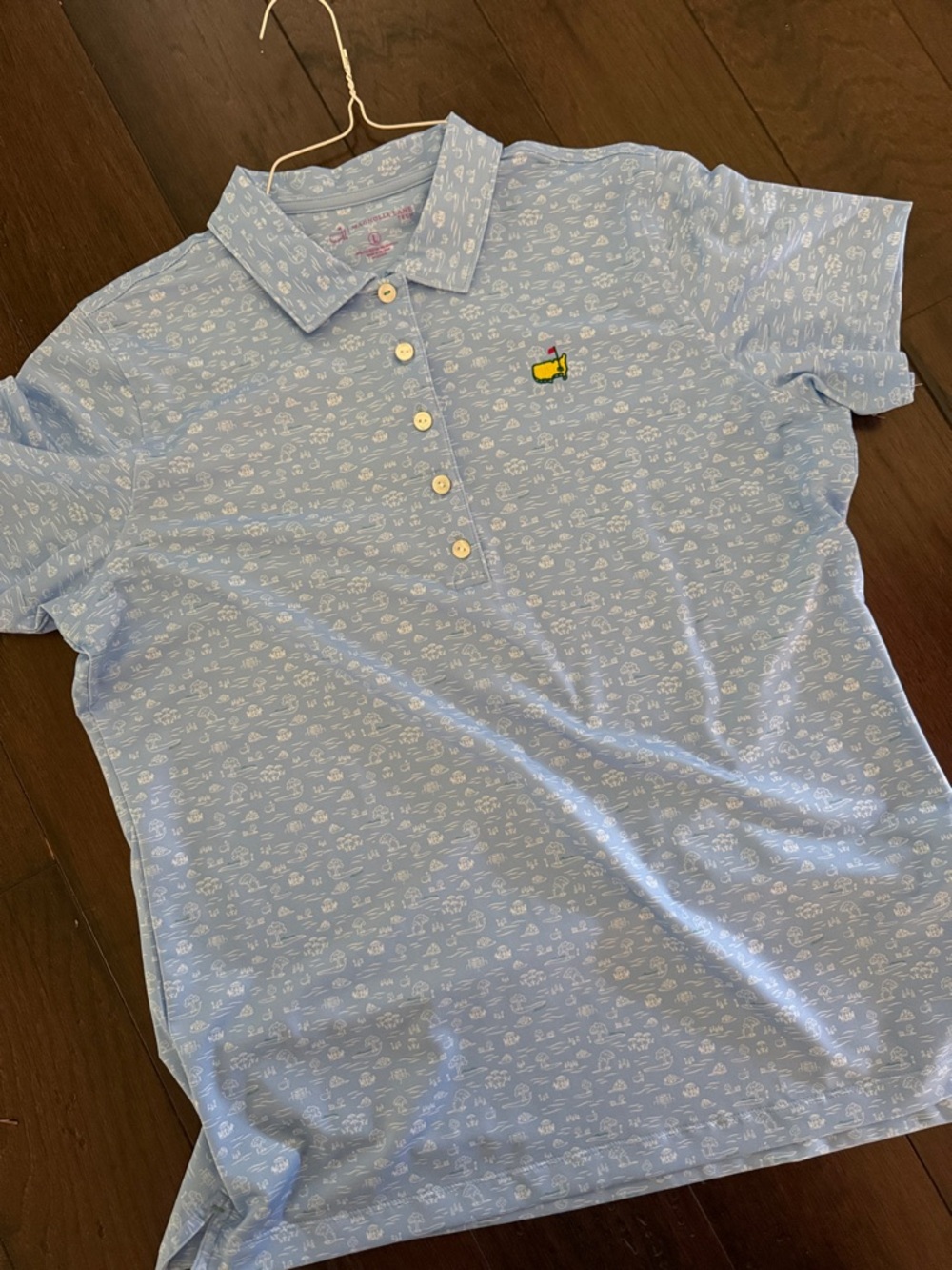 Magnolia Light Blue Polo Top with Small Yellow Embroidered Accent